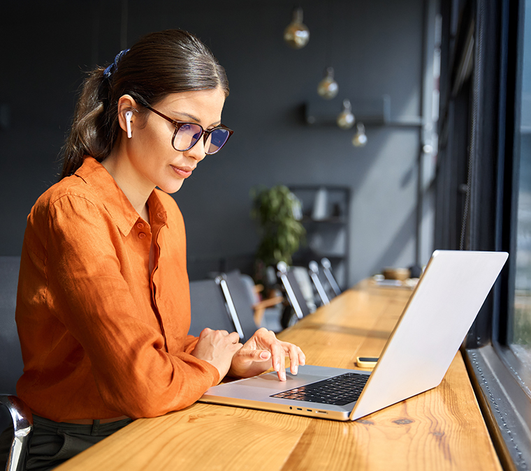 advisor working in an office on a laptop